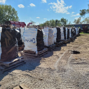 Large bags of firewood on pallets