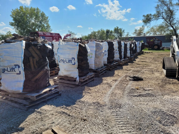 Large bags of firewood on pallets