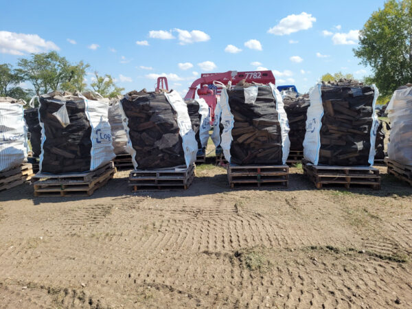 Large bags of firewood on pallets