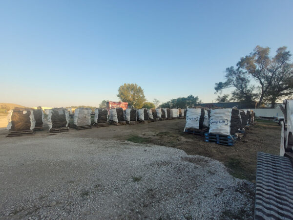 Large bags of firewood on pallets